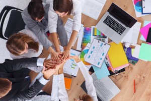 Business team with hands together - teamwork concepts