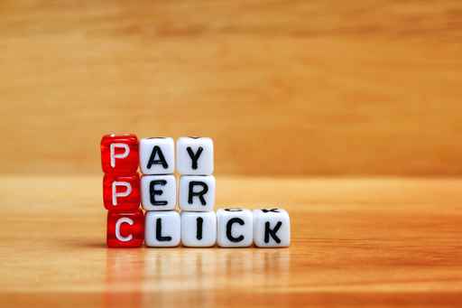 PPC Pay Per Click dices on wooden table